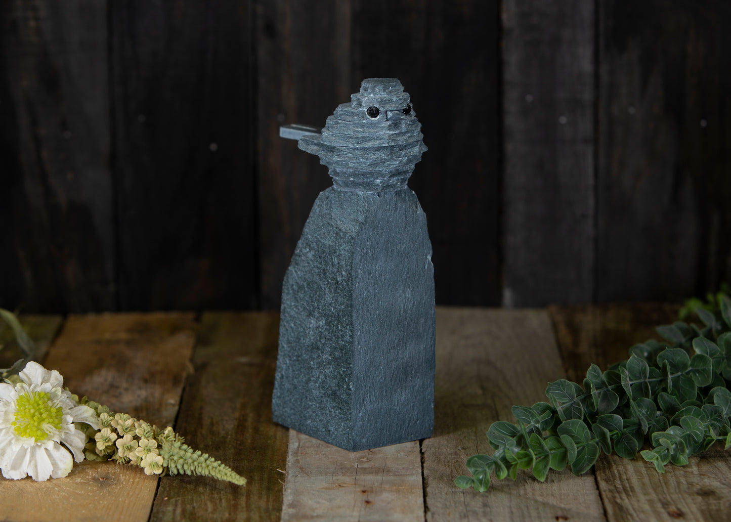 A slate Robin sculpture on a rock - slate ornament