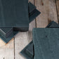 two sets of slate table mat