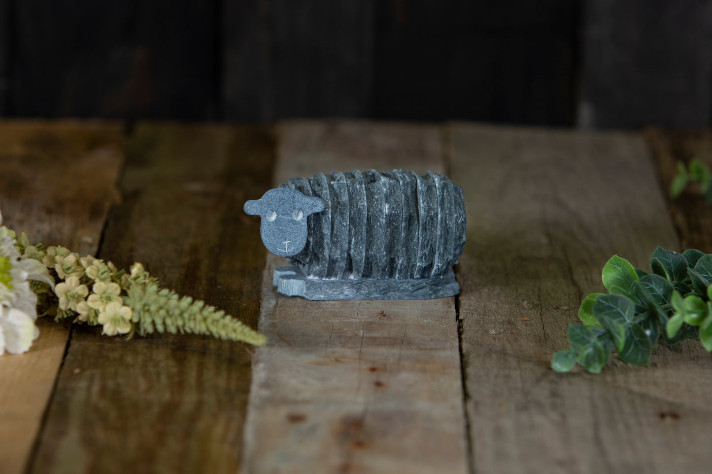 Slate lying lamb sculpture